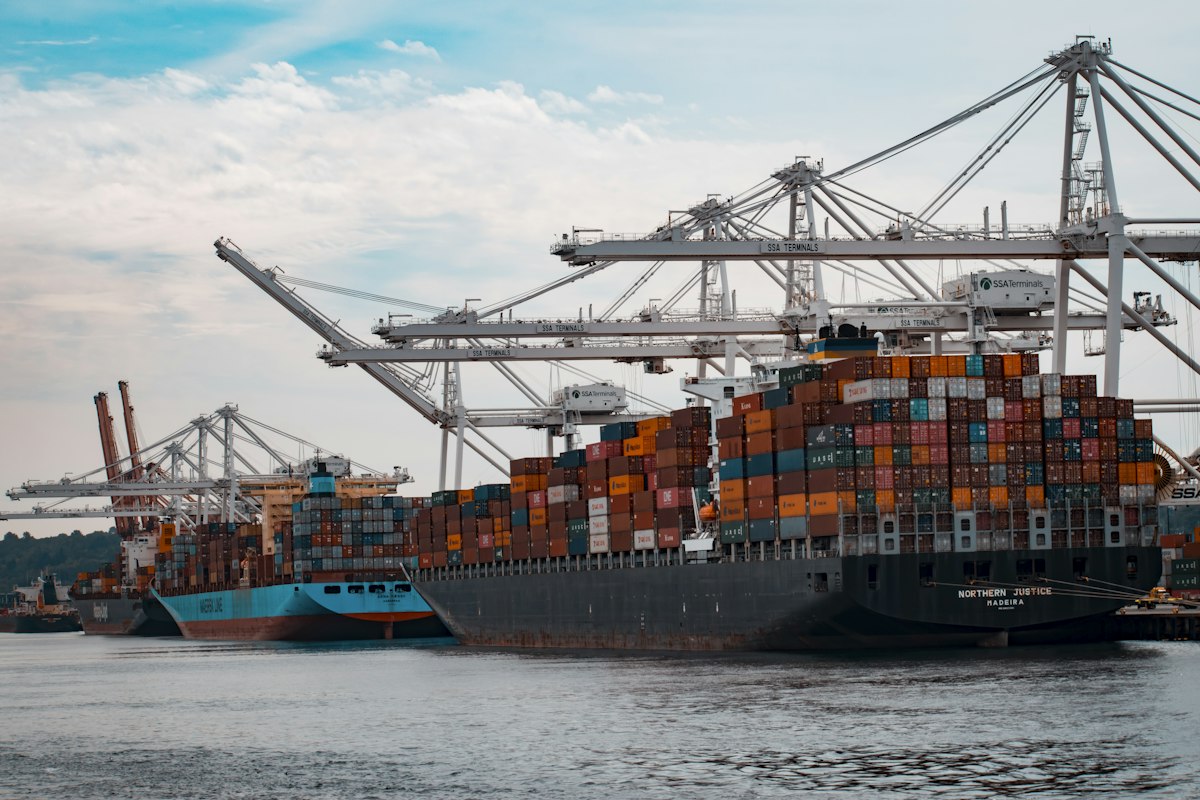 Container ship being loaded at a port